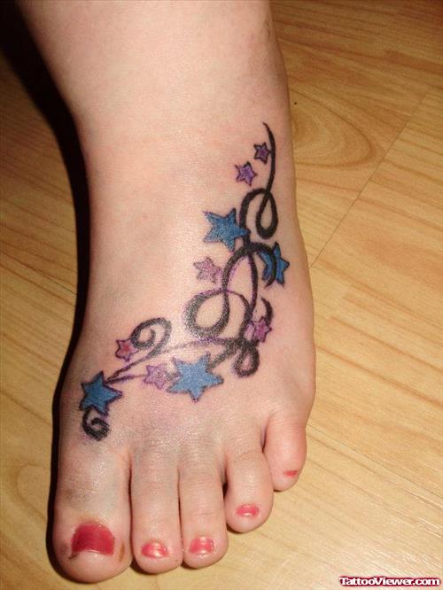 Colored Stars And Tribal Left Foot Women Tattoo