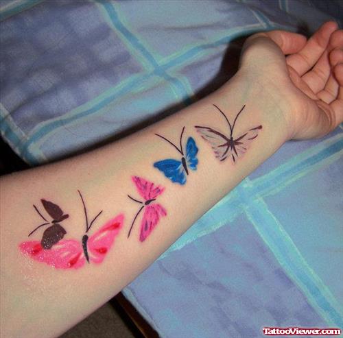 Colored Butterflies Women Tattoo On Left Forearm