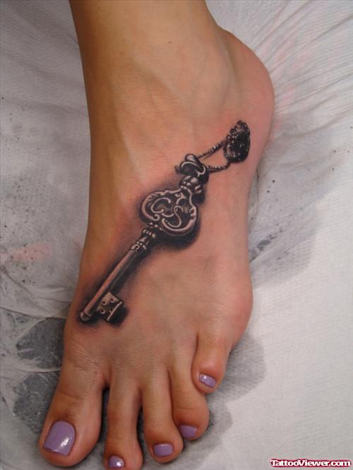 Grey Ink 3D Key Tattoo On Foot For Women
