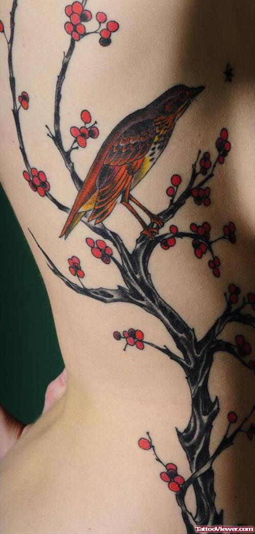 Bird Sitting In Tree Women Tattoo