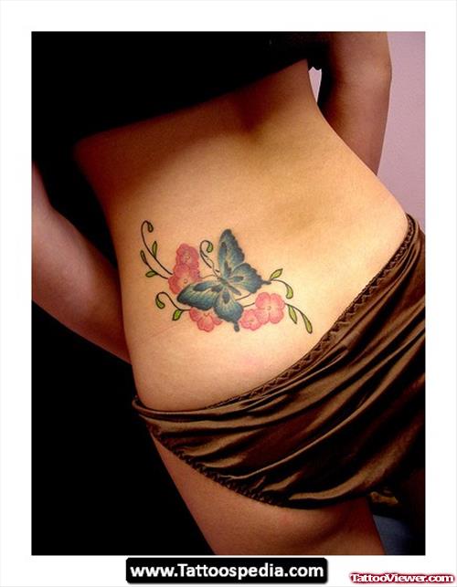 Pink Flowers And Blue Butterfly Tattoos On Lowerback