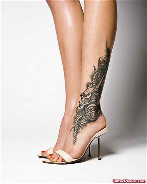 Grey Ink Dragon Tattoo On Foot For Women