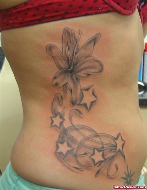 Stars And Lily Flower Women Tattoo On Side Rib