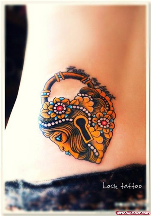 Colored Lock Heart Women Tattoo On Lowerback