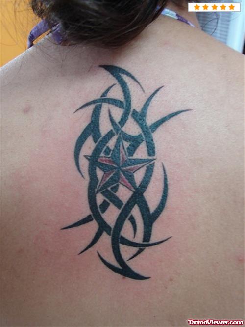 Red Nautical Star And Tribal Women Tattoo On Back