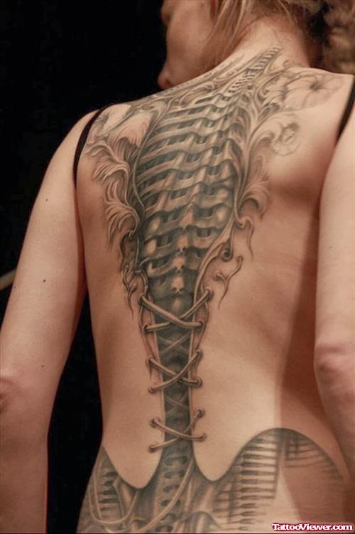 Grey Ink Ripped Skin Skeleton Tattoo On Back For Women