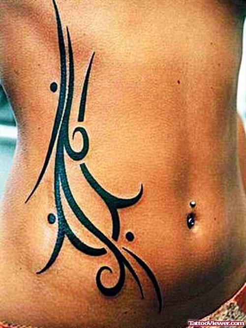 Black Ink Tribal Women Tattoo On Hip