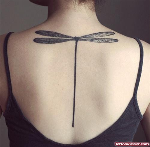 Grey Ink Dragonfly Tattoo On Back For Women