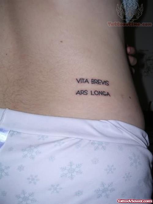 Vita Brevis Tattoo On Side Rib