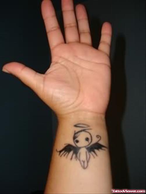 Funny Angel Tattoo On Wrist