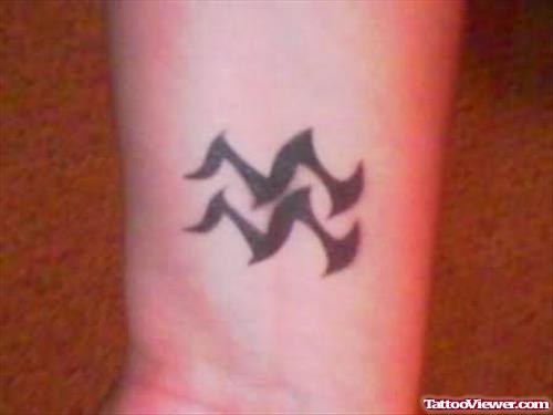 Zodiac Symbol Tattoo On Wrist