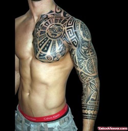 African Tattoo On Man Chest And Sleeve