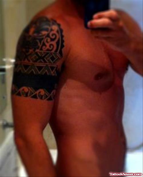 African Tattoo On Man Right Shoulder