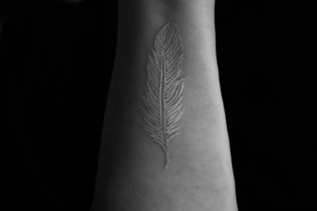 African Feather Tattoo On Arm