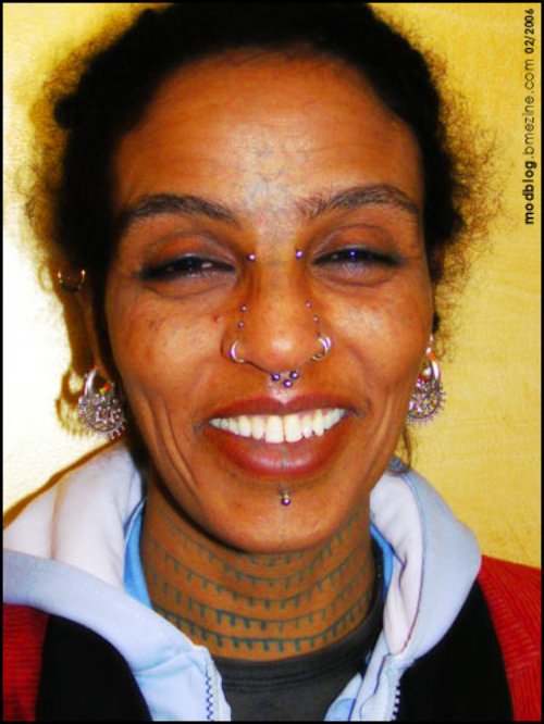 African Tattoo On Girl Neck