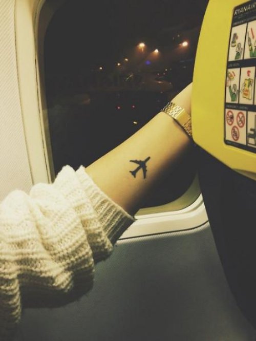 Attractive Black Ink Small Airplane Tattoo