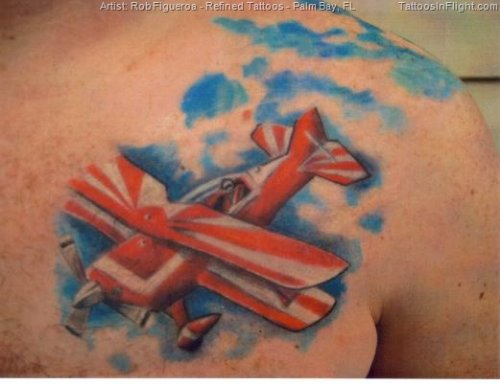 Red Airplane Tattoo On Man Chest