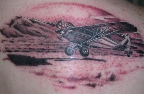 Grey Ink Airplane Tattoo