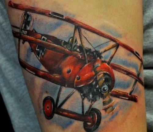 Colored Airplane Tattoo On Bicep