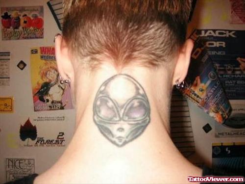 Grey Ink Alien Tattoo On Back Neck
