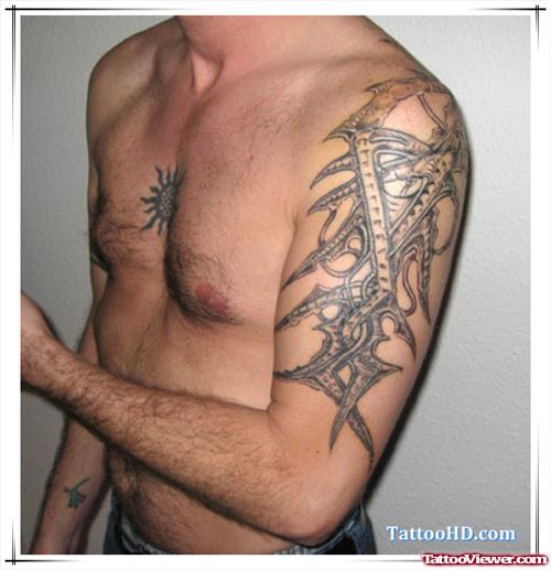 Grey Ink Tribal Alien Tattoo On Left Half Sleeve