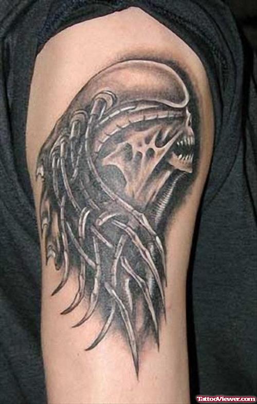 Grey ink Alien Head Tribal Tattoo On Half Sleeve
