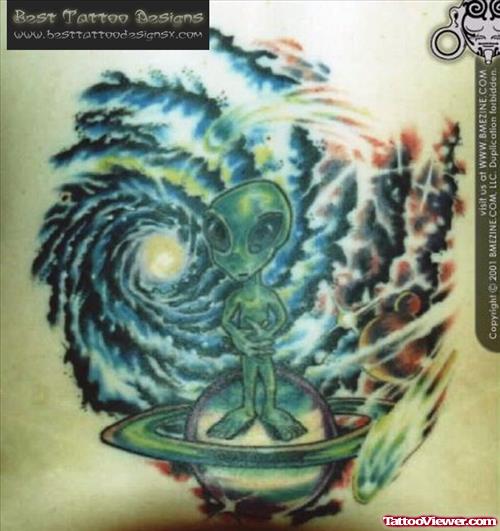 Green Alien Stand On Palnet Tattoo
