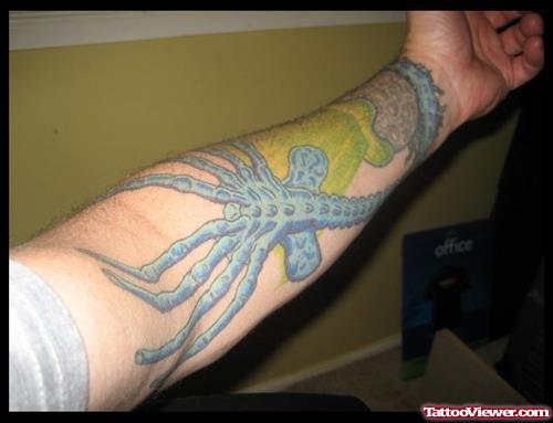 Colored Ink Alien Tattoo On Left Arm