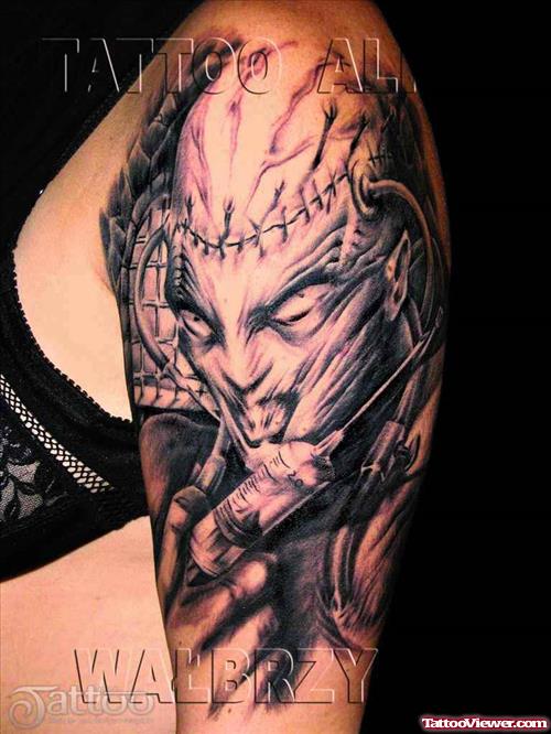 Alien With Syringe Grey Ink Tattoo On Left Half Sleeve