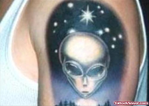 Twinkling Stars And Alien Head Tattoo On Left Shoulder