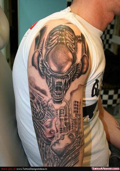 Grey Ink Alien Tattoo On Man Right Half Sleeve
