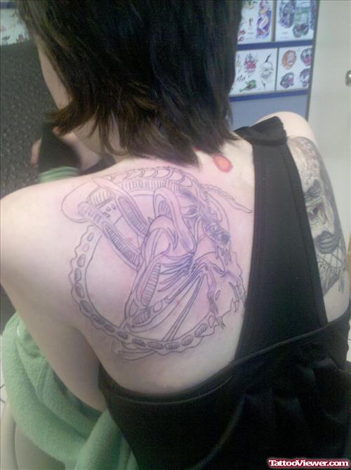 Grey Ink Alien Tattoo On Girl Back Shoulder