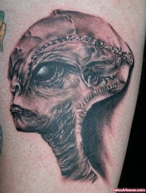 Grey Ink Alien Head Tattoo