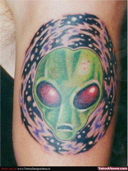 Green Ink Alien Head Tattoo On Left Bicep