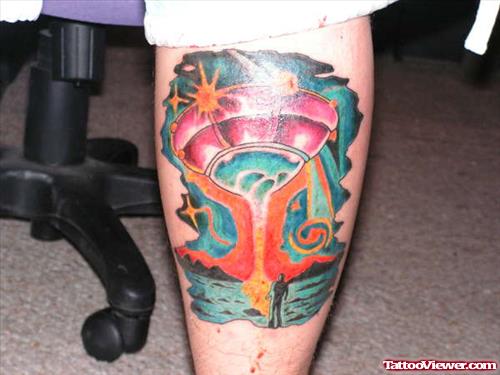 Colored Ink Alien Spaceship Tattoo On Back Leg