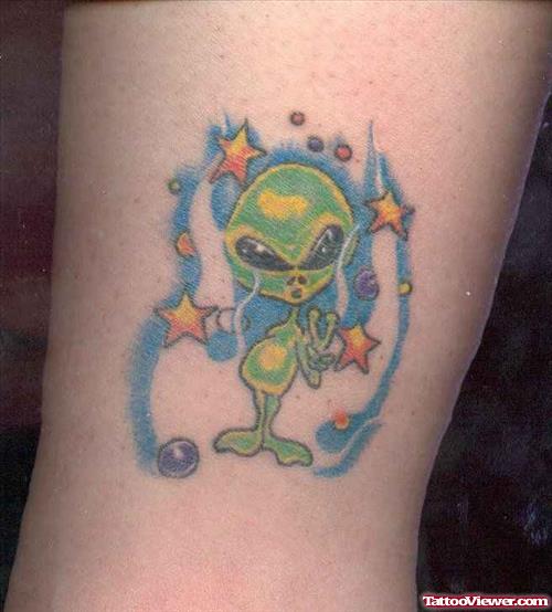 Green Ink Alien Tattoo On Bicep