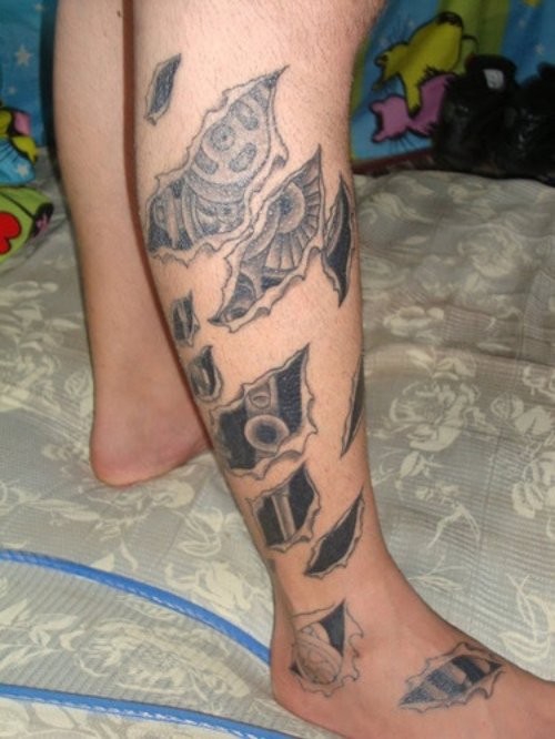 Grey Ink Alien Ripped Skin Tattoo On Leg