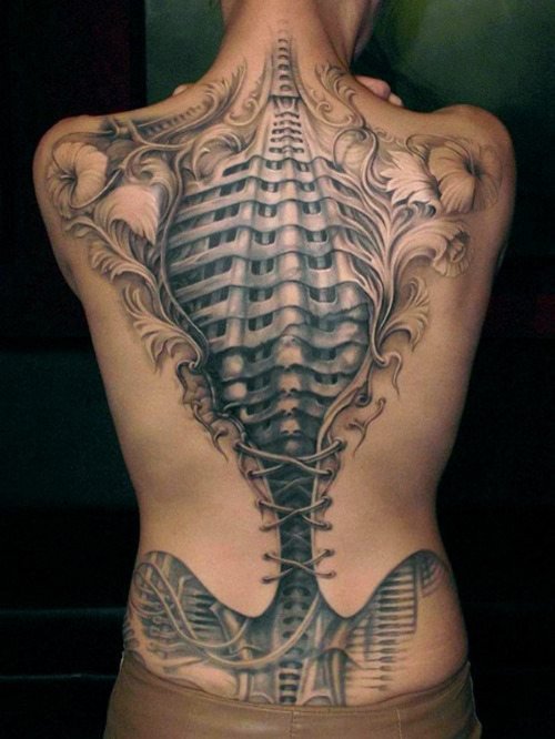 Grey Ink Alien In Corset Tattoo On Back