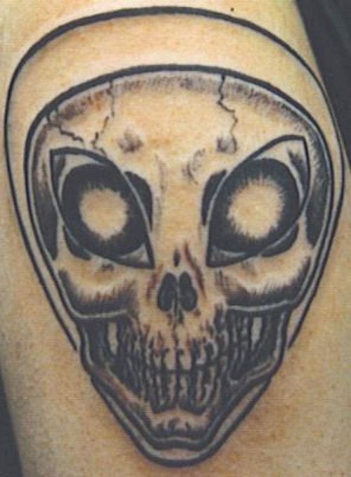 Grey Ink Alien Skull Tattoo