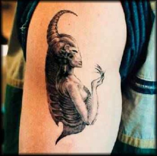Grey Ink Alien Girl Tattoo On Right Bicep