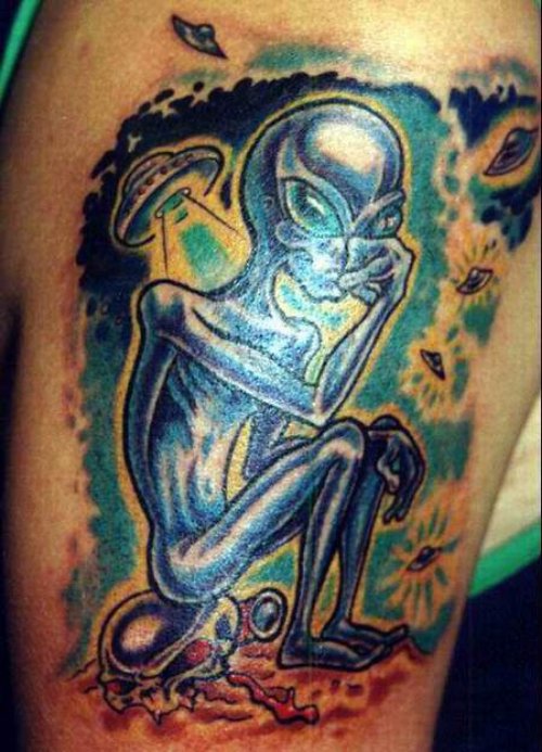 Alien Sitting On Skull Color ink Tattoo