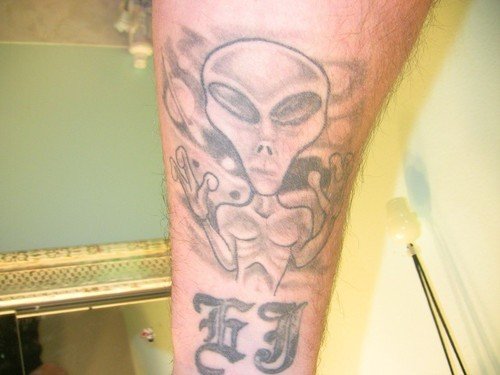 Amazing Grey Ink Alien Tattoo On Arm