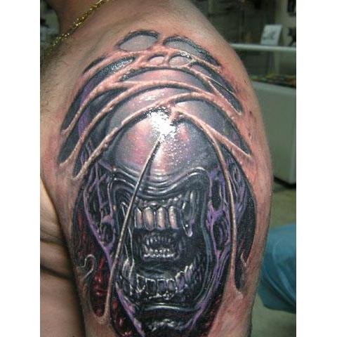 Monster Alien Head Tattoo On Left SHoulder