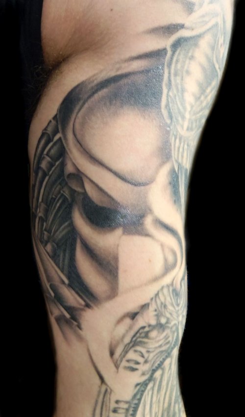 Grey Ink Alien Tattoo On Man Sleeve