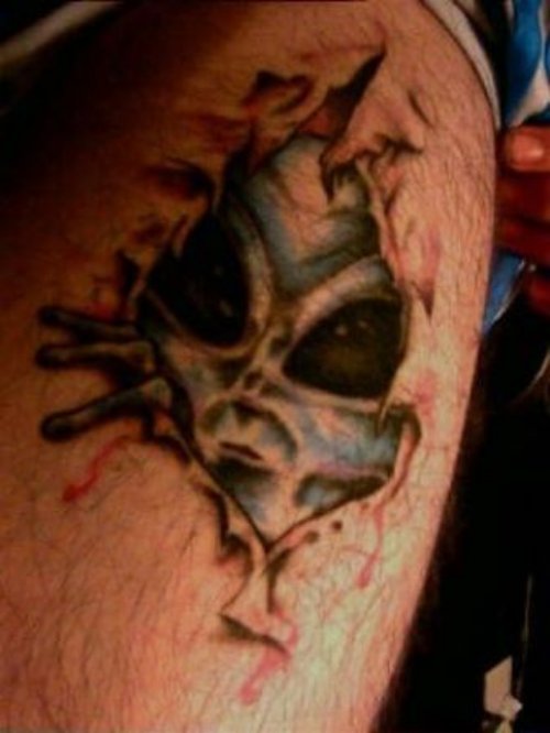 Ripped Skin Alien Face Tattoo Design