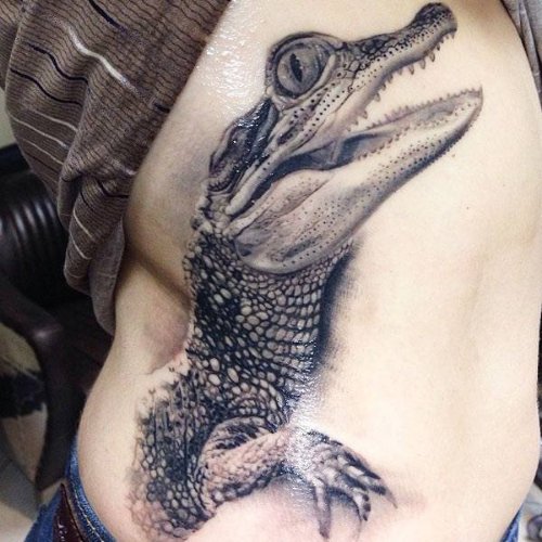 Grey Ink Alligator Tattoo On Left Side Rib