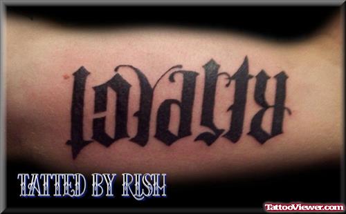 Loyalty Ambigram Tattoo On Bicep