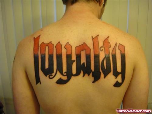 Loyalty Ambigram Tattoo On Upperback