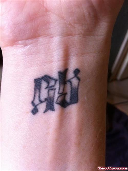 Grey Ink Ambigram Wrist Tattoo
