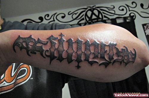 Sinner Ambigram Tattoo On Left Arm